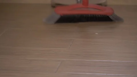 Cleaning the floor with a broom Stock Footage 125429019