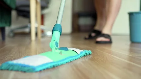 Cleaning the floor with a mop closeup. Hosehold and clean home concept. Stock Footage 301976495