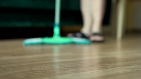 Cleaning the floor with a mop closeup. Hosehold and clean home concept. Stock Footage 301976496