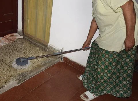 Cleaning floor with mop Stock Photos