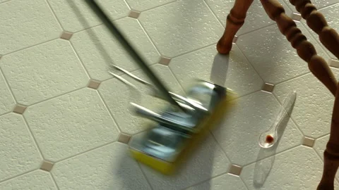 Cleaning Floor vith spoon and baby chair GT6063 Stock Footage 130881874
