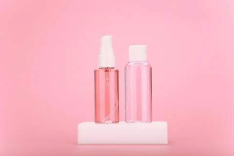 Cleaning foam or gel and moisturizing skin lotion in transparent bottle on white Stock Photos