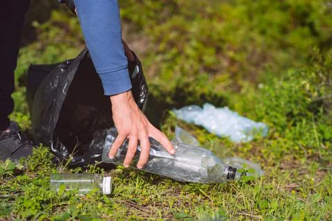 Cleaning-up forest of plastic garbage. Plastic water bottles pollution Stock Photos