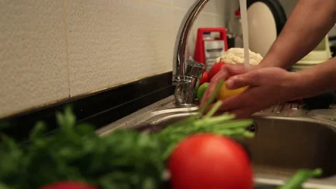 Cleaning Fresh Vegetables in Kitchen Stock Footage 343737898