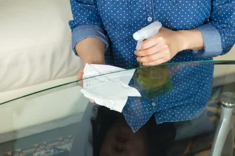 Cleaning glass table Stock Photos