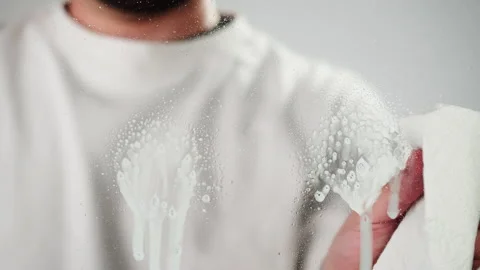 Cleaning glass, using spray detergent on grey chroma key background. Spring Stock Footage 182023567