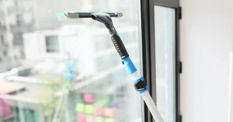 Cleaning glass window with squeegee closeup Stock-Footage 273316050