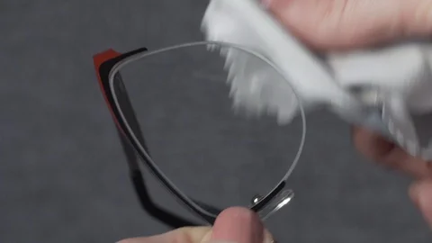 Cleaning glasses with microfiber cleaning cloth Stock Footage 98140838