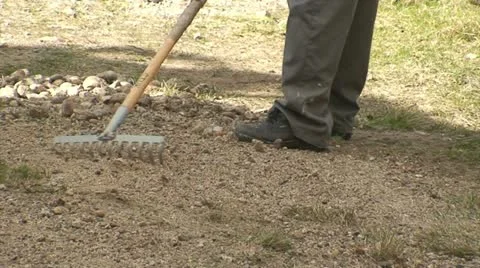 Cleaning gravel on a path Stock Footage 10833441