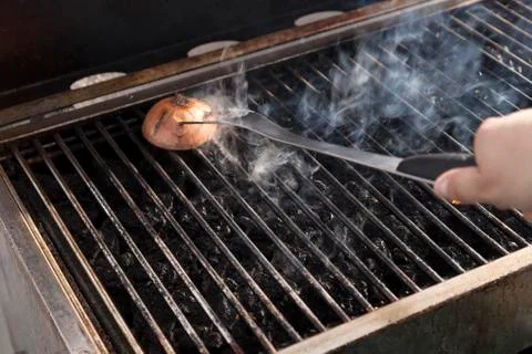 Cleaning the grill Stock Photos