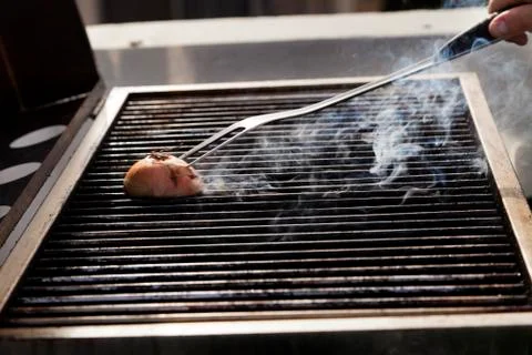 Cleaning the grill Stock Photos