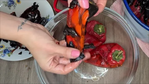Cleaning Grilled Red Peppers Stock Footage 166794089