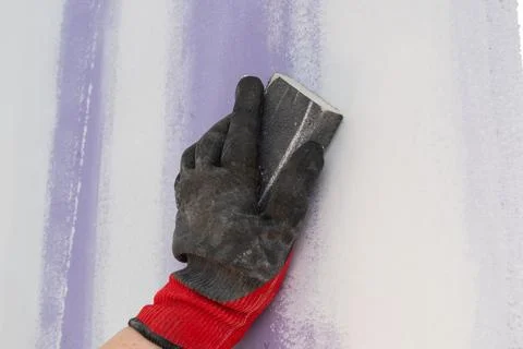 Cleaning grout on the wall Stock Photos