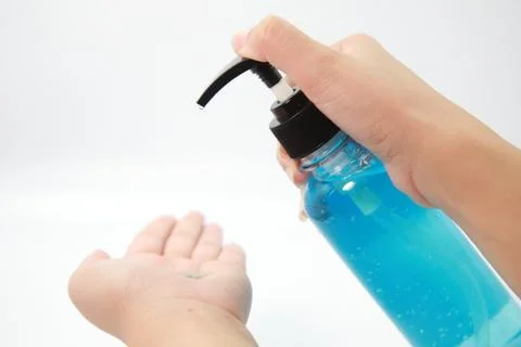 Cleaning hand using alcohol gel. 스톡 사진