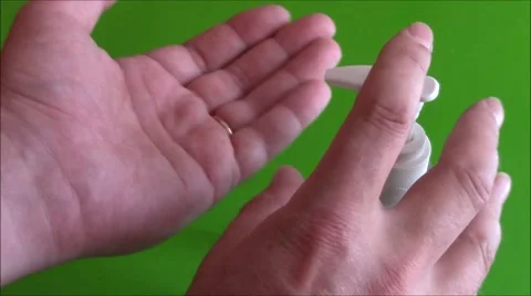 Cleaning hands with hand sanitizer Stock Footage 52458039