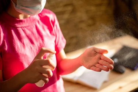 Cleaning hands by using hand sanitizer Stock Photos