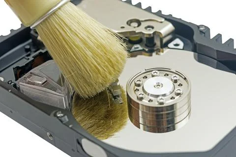 Cleaning the hard disk with a brush Stock Photos