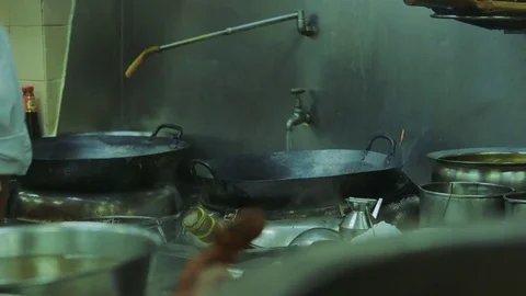 Cleaning hot wok Stock Footage 77982814