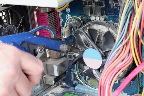 Cleaning the inside of a computer with compressed air. Maintenance and cleani Stock Photos