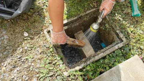 Cleaning inside the grease trap. Stock Photos