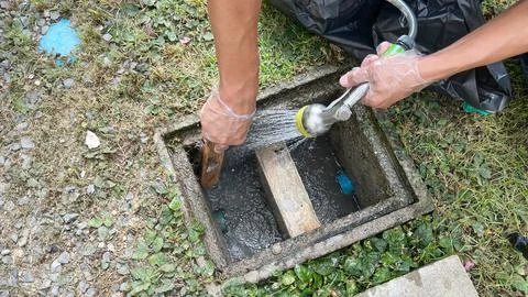 Cleaning inside the grease trap. Stock Photos