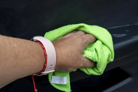 Cleaning the interior of a car with a cloth Stock Photos