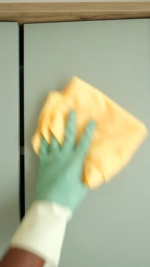 Cleaning kitchen cabinets with a microfiber cloth Stock Footage 320855260