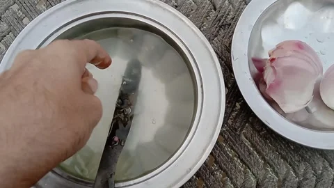 Cleaning a Kitchen Knife with Water Stock Footage 347758134