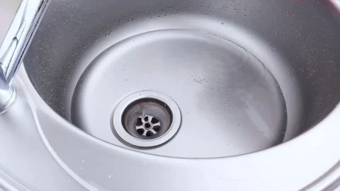 Cleaning a Kitchen Sink Drain- Easy Strainer Removal Tips 스톡 동영상 312199020