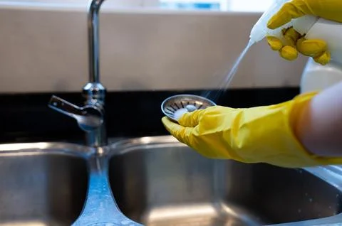 Cleaning kitchen sink filter Stock Photos