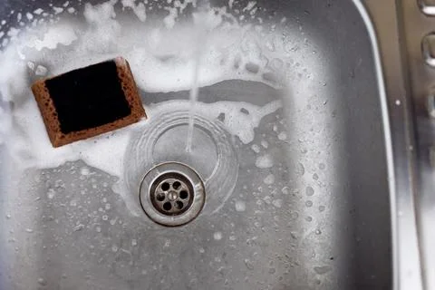 Cleaning the kitchen sink Stock Photos