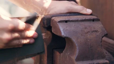 Cleaning the knife from rust with sandpaper. Stock Footage 135044147