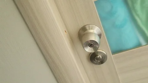 Cleaning the knob of the door  Stock Footage 128606066