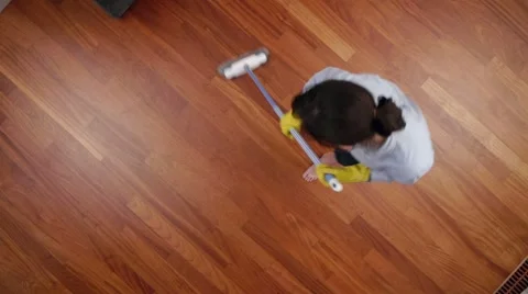 Cleaning lady overhead broom Video stock 13003533