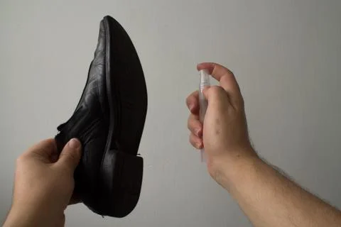 Cleaning left shoe Stock Photos