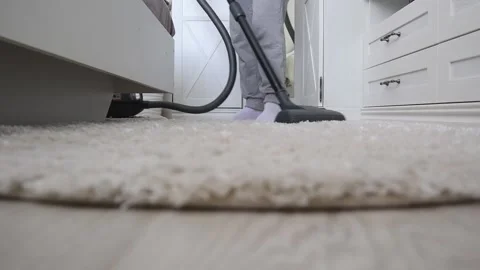 Cleaning a light carpet with a vacuum cleaner. House cleaning. Stock-Footage 198907607