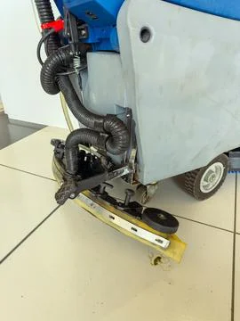 Cleaning machine is parked inside a building near the floor with tiles Stock Photos