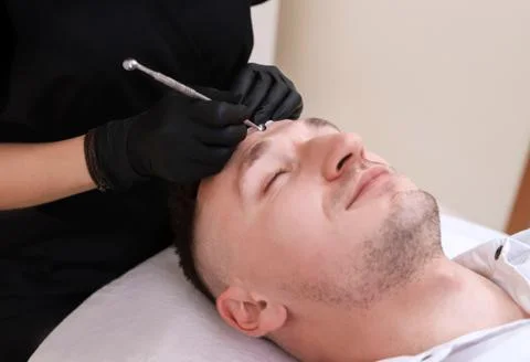 Cleaning man face. Stock Photos