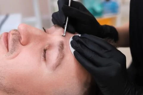 Cleaning man face. Stock Photos
