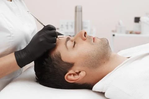 Cleaning man face. Stock Photos