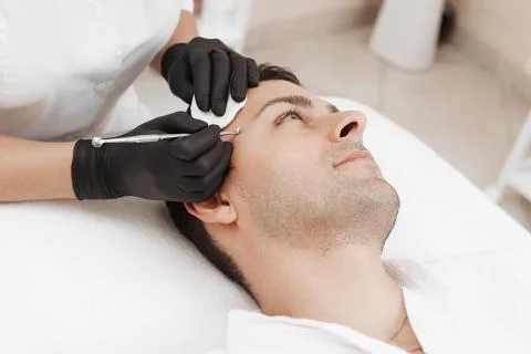 Cleaning man face. Stock Photos