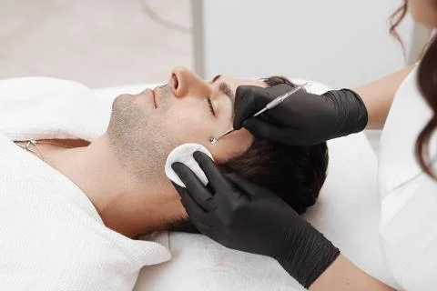 Cleaning man face. Stock Photos