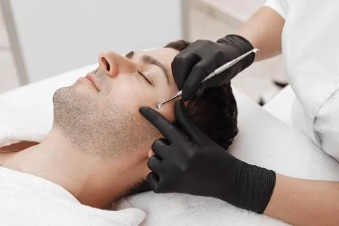 Cleaning man face. Stock Photos