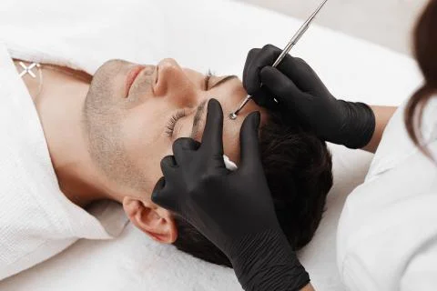 Cleaning man face. Stock Photos