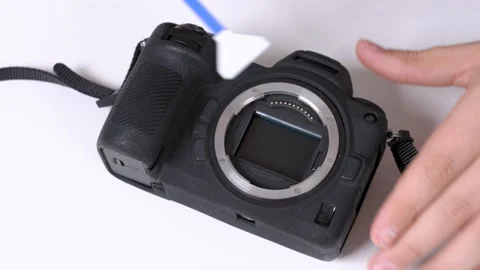 Cleaning matrix of mirrorless photo camera with professional tool at home Stock Footage 132297627