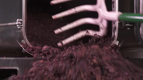 Cleaning the mechanical wine press maker making vine from grapes. Stock Footage 153813178