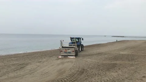 Cleaning mechanism preparing a sandy beach for tourists in the city of Marbella Stock Footage 132780439