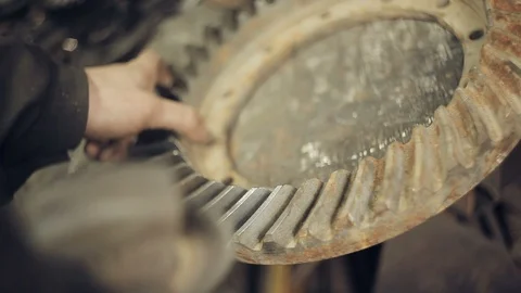 Cleaning the metal gear from rust Stock Footage 94861197