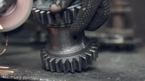 Cleaning the metal gear from rust Stock Footage 95269569