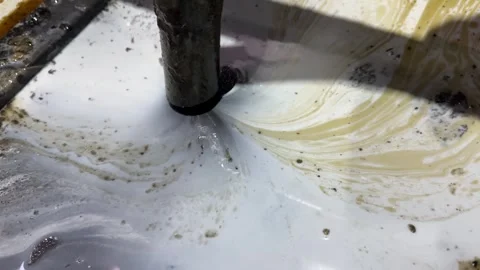 Cleaning milling machine with vacuum sucking dirty coolant fluid from the chi Stock Footage 325649504